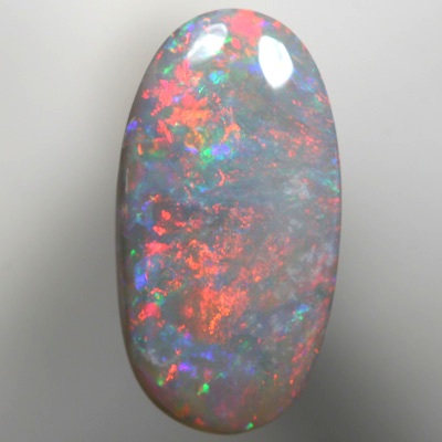 SOLID SEMI BLACK OPAL Sparkles of fire red and green over mauve